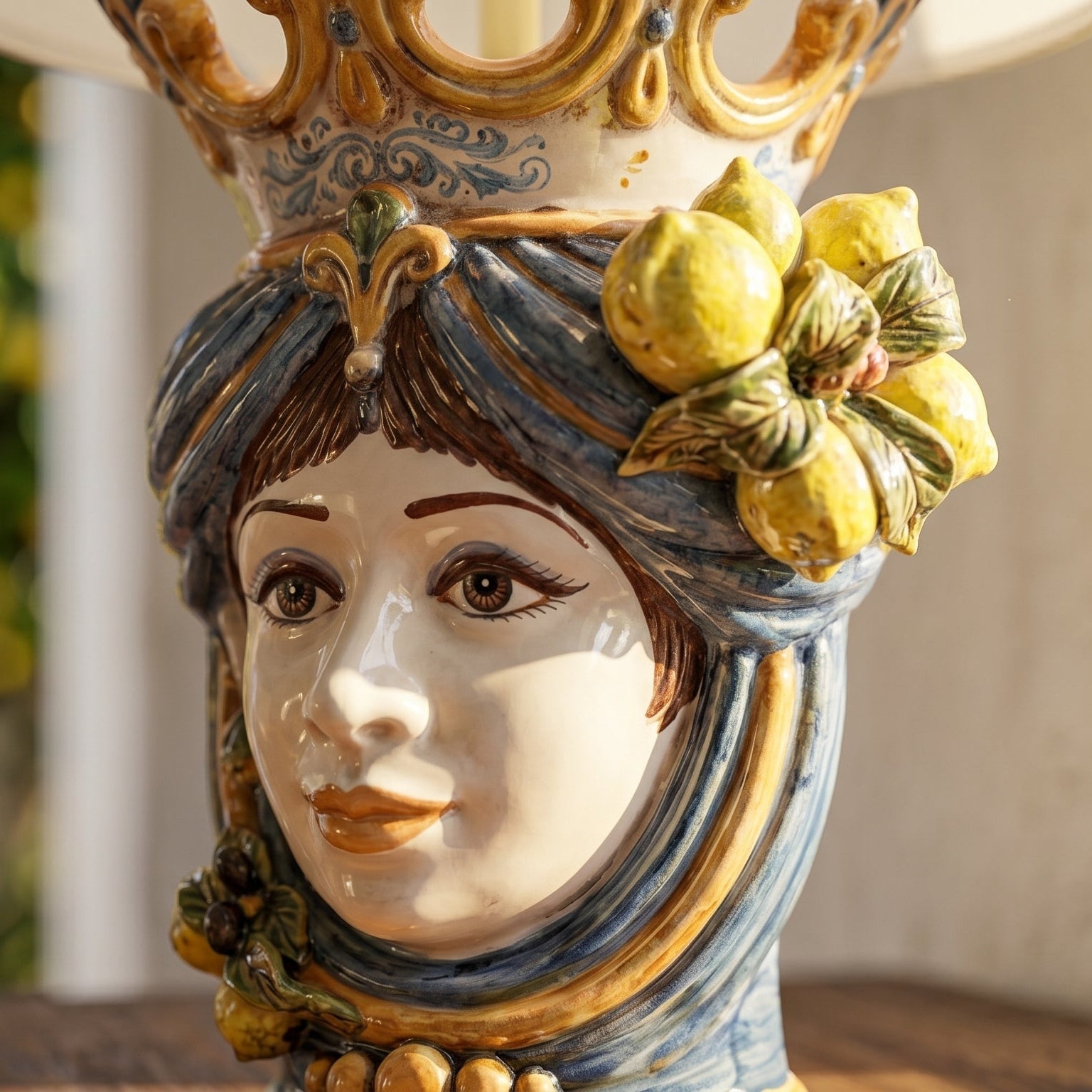 Handcrafted Teste di Moro lamp with ceramic face, lemon accents, and ornate crown, blending tradition and modern design.