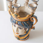 Handcrafted Teste di Moro ceramic vase with ornate blue and gold detailing, featuring a sculpted face and candle holders.