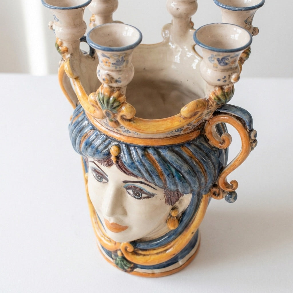 Handcrafted Teste di Moro ceramic vase with ornate blue and gold detailing, featuring a sculpted face and candle holders.