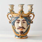 Handmade Teste di Moro ceramic vase with blue hair, mustache, and three candle holders, blending tradition and modern design.