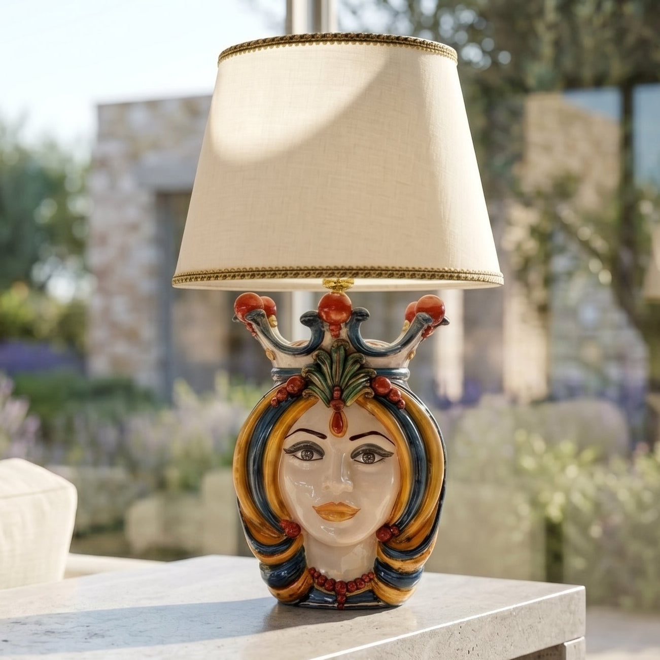 Handcrafted Teste di Moro table lamp with colorful ceramic face, crown, and beige shade, perfect for modern or traditional decor.