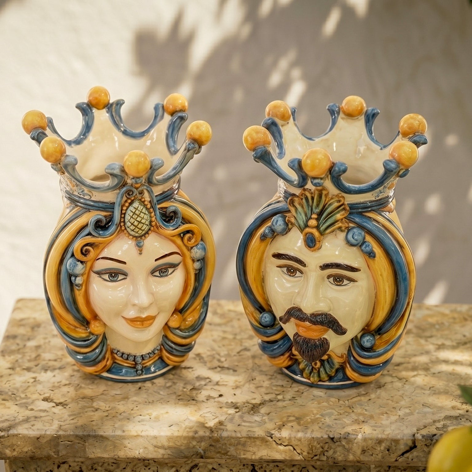 Handcrafted Teste di Moro ceramic vases with crowned male and female faces, vibrant blue and gold details