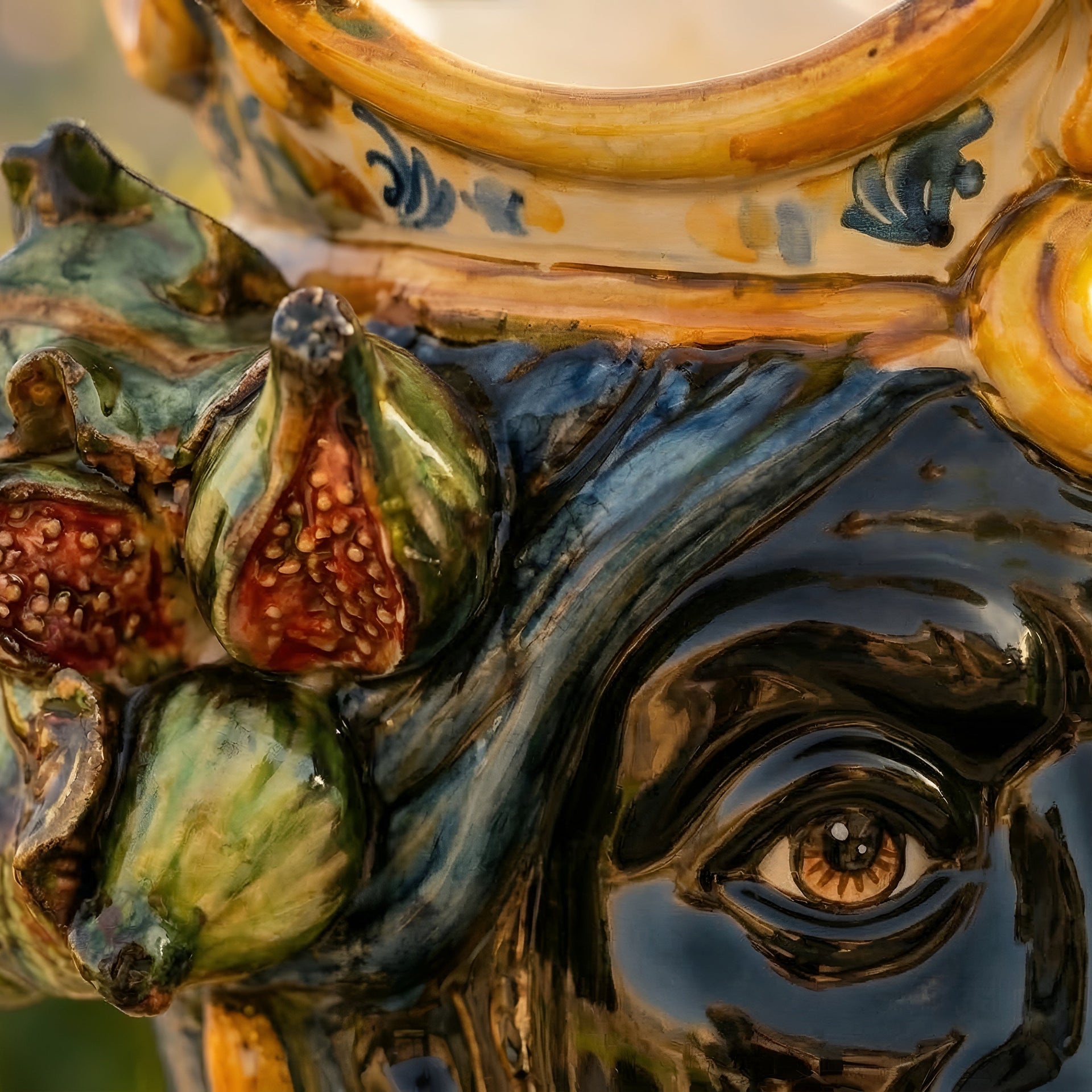Handcrafted Teste di Moro ceramic with figs, vibrant glazes, and detailed eye design for modern decor.