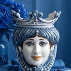 Handcrafted Teste di Moro ceramic vase with blue crown, floral accents, and elegant facial details