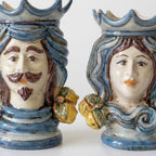 Handmade Teste di Moro ceramic vases with crowned male and female faces, blue glaze, and fruit accents