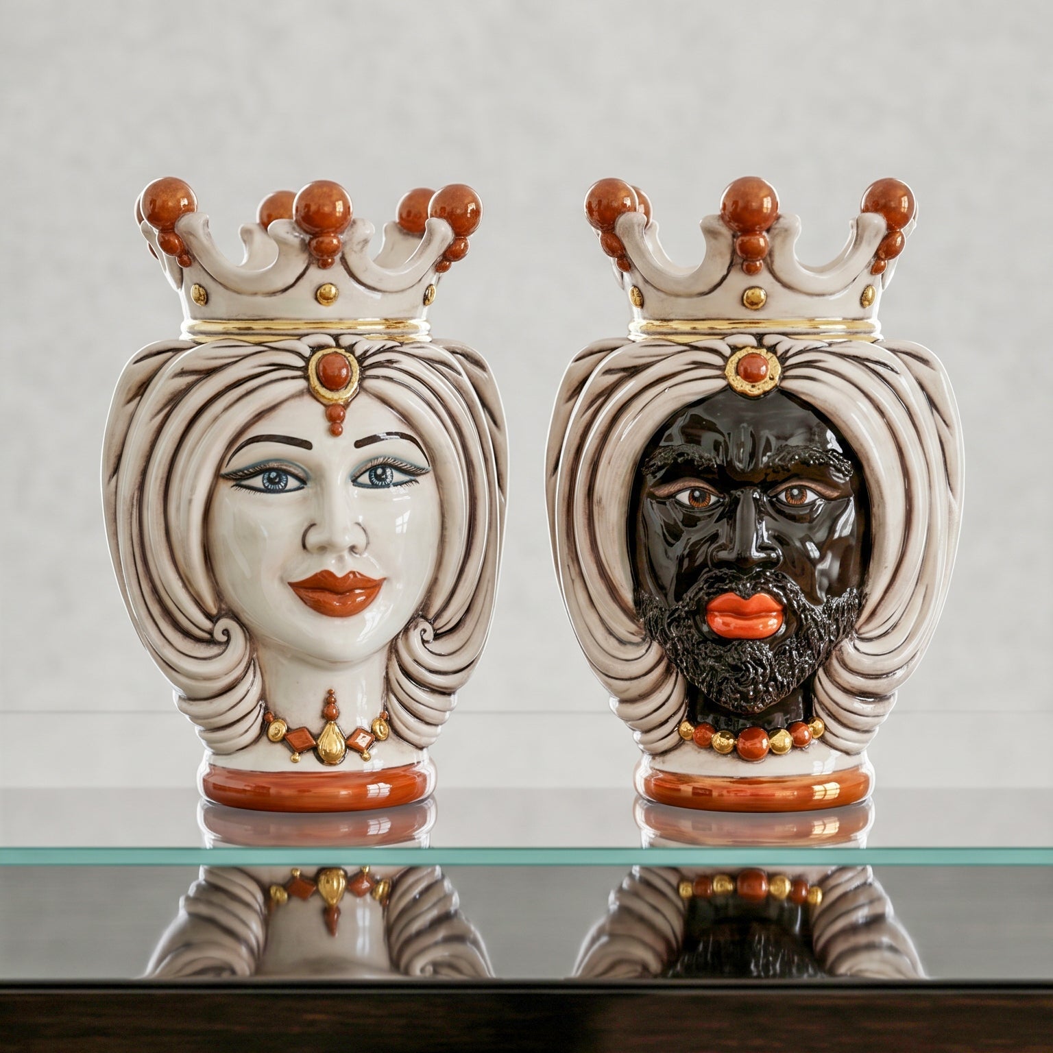 Handmade Teste di Moro ceramic vases with crowned male and female faces, traditional Sicilian decor