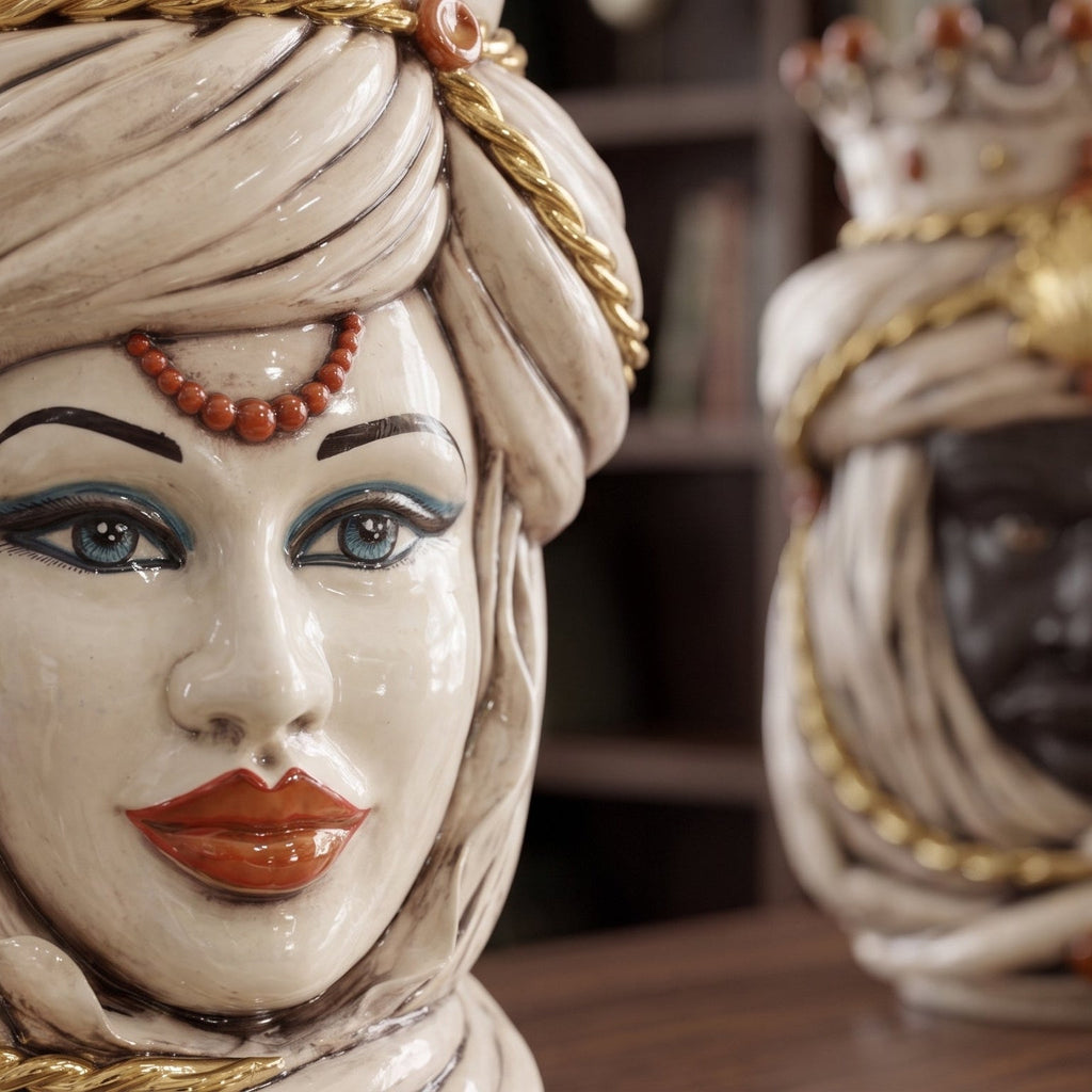 Handmade Teste di Moro ceramic sculpture with detailed turban, blue eyes, and coral beads, blending tradition and modern design.