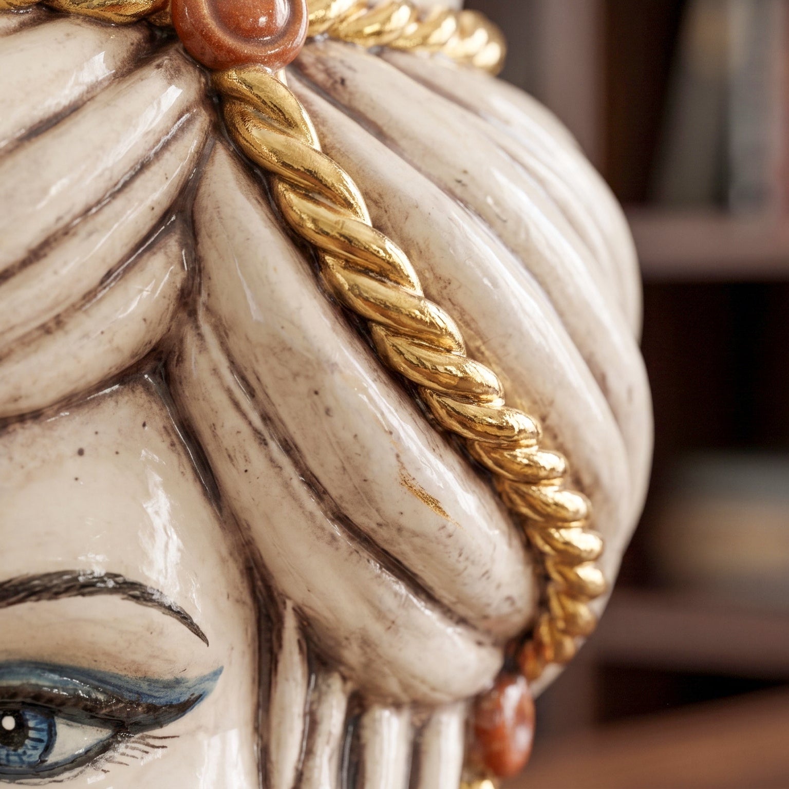 Handcrafted Teste di Moro ceramic with gold rope detail and blue eye, blending tradition and modern design.