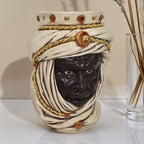 Handcrafted Teste di Moro ceramic vase with detailed turban and gold accents, blending tradition and modern design.