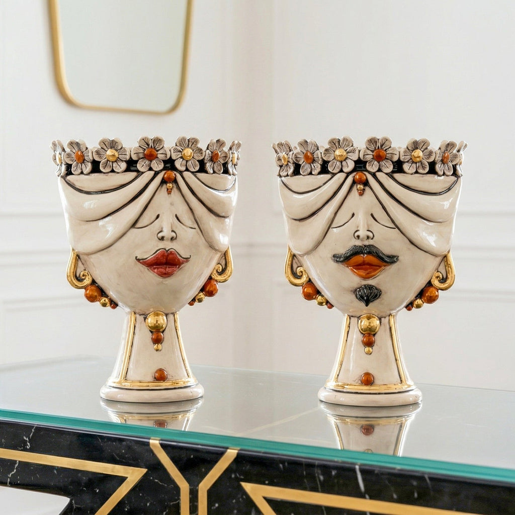Handcrafted Teste di Moro ceramic vases with floral crowns, gold accents, and expressive faces for modern home decor