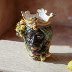 Handmade Teste di Moro ceramic vase with crown, lemons, and green swirls, blending tradition and modern design.