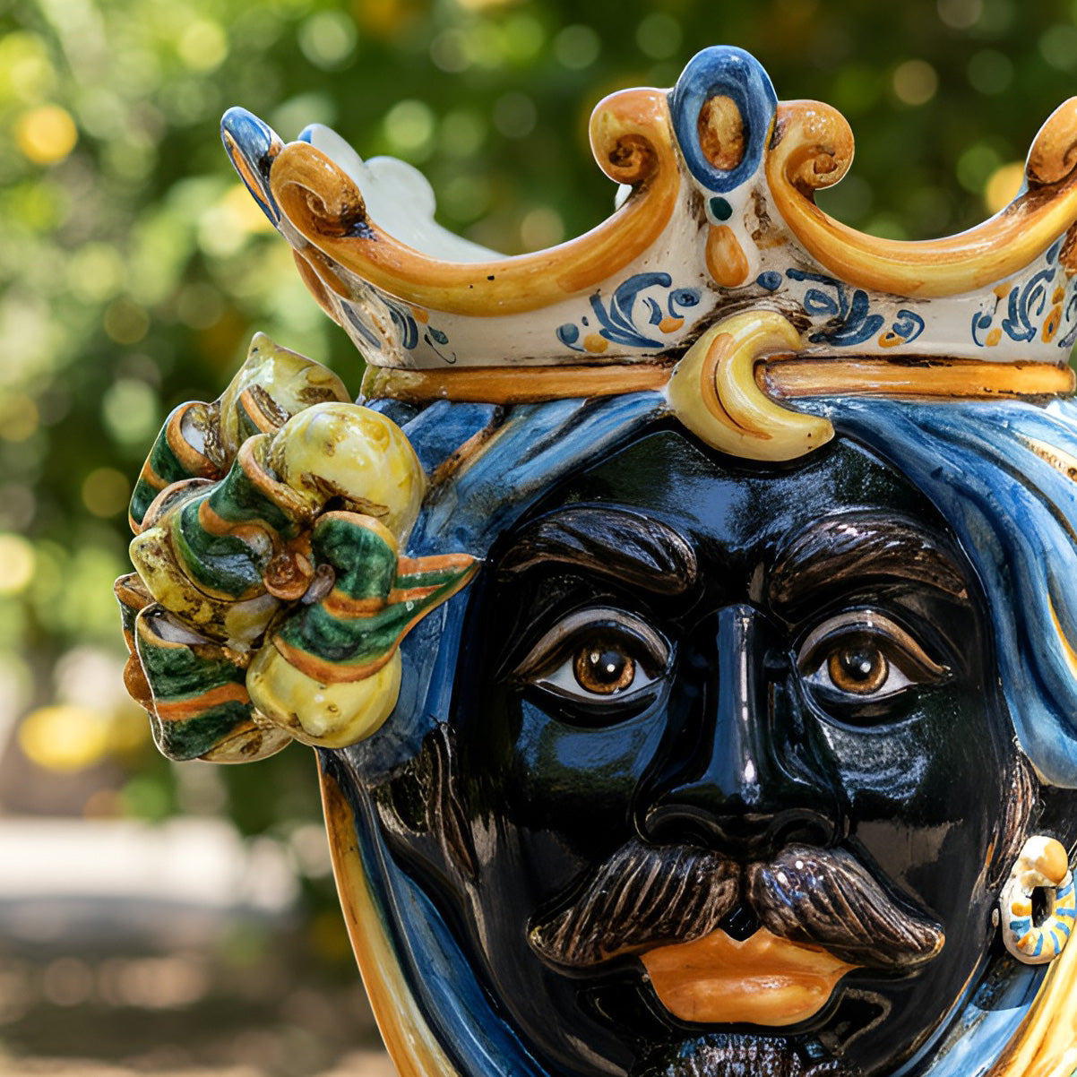 Handcrafted Teste di Moro ceramic with crown and floral details, traditional Sicilian art for home decor