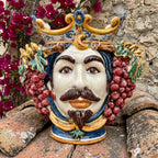 Handmade Sicilian Testa di Moro with crown, grapes, and vibrant colors, perfect for Mediterranean decor.