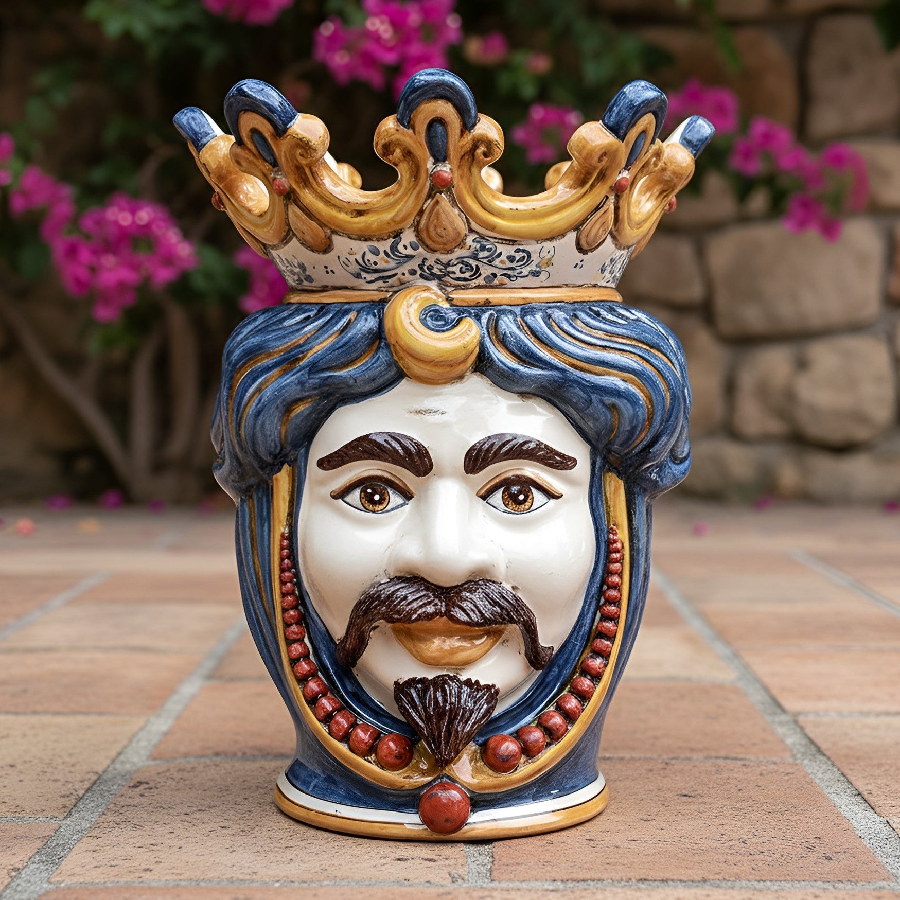 Handmade Teste di Moro ceramic head with crown, blue hair, and mustache, outdoor garden decor