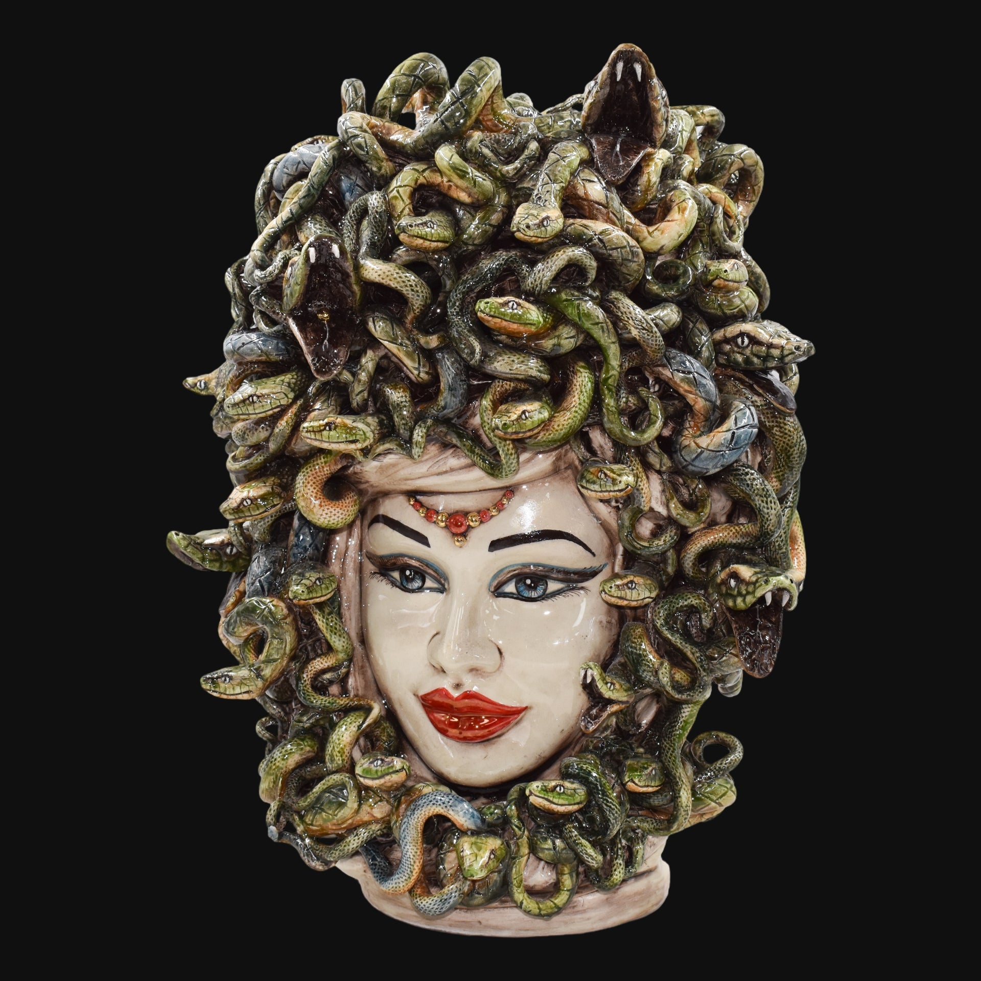 Handcrafted Medusa head sculpture with vibrant snakes, blending tradition and modern design for unique home decor.