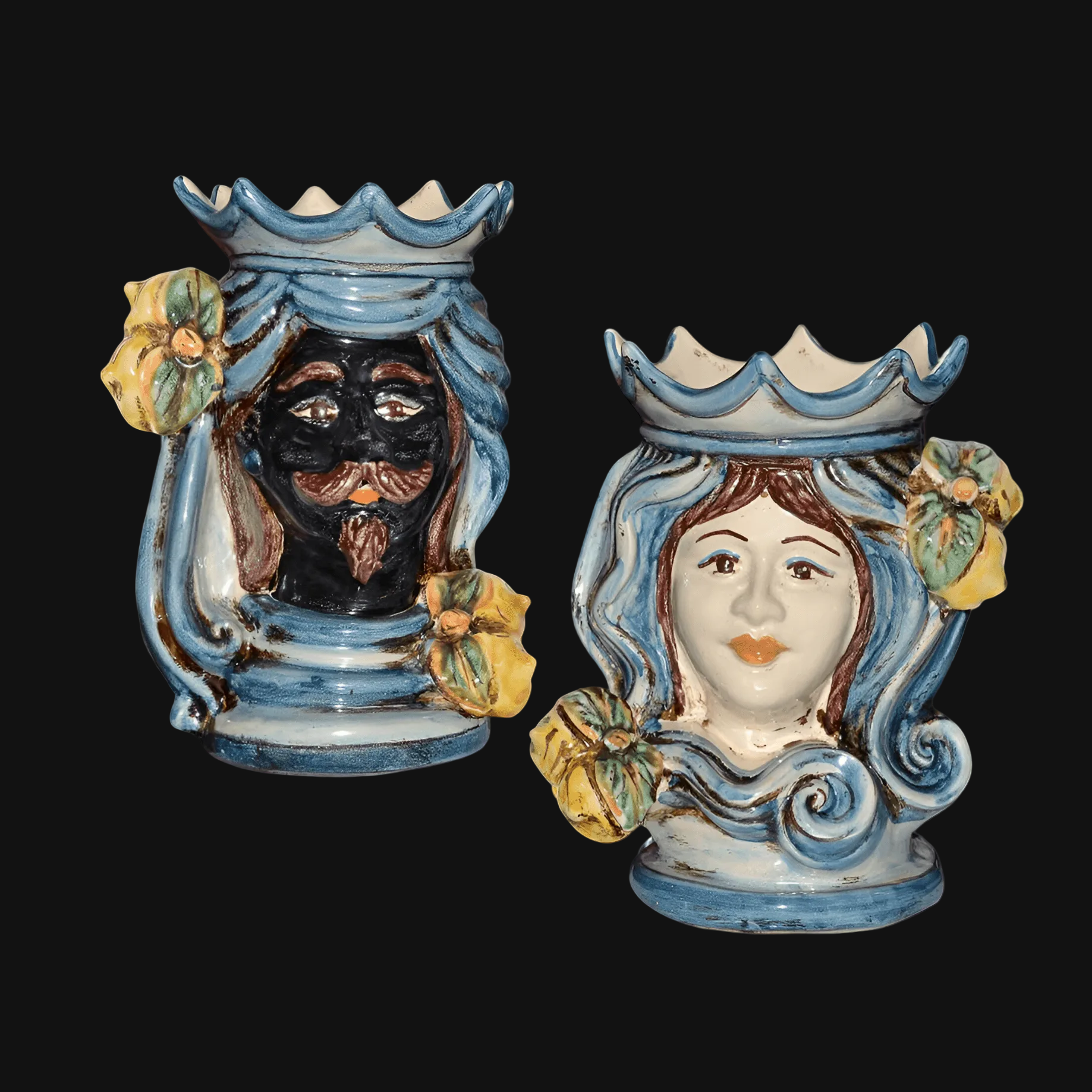 Handmade Teste di Moro ceramic vases with blue glaze, floral accents, and traditional male and female faces.