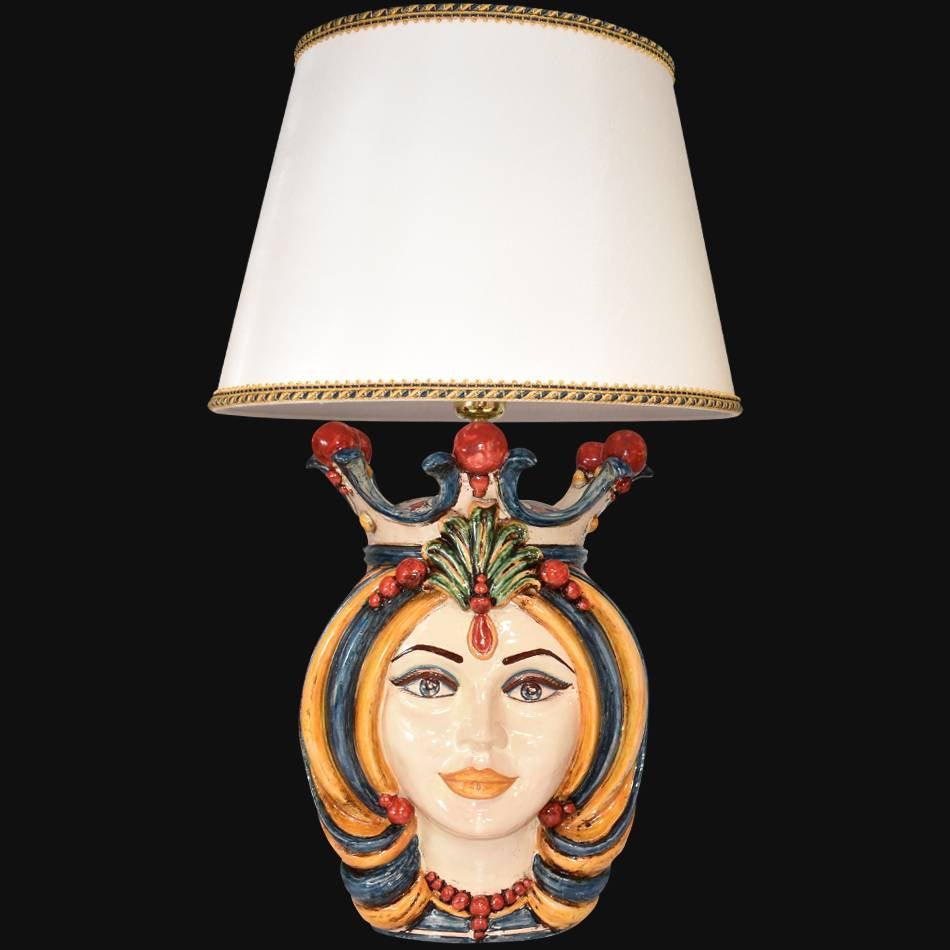 Handmade Teste di Moro table lamp with colorful ceramic face, white shade, and gold trim, blending tradition and modern design.