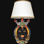 Handcrafted Teste di Moro table lamp with colorful ceramic face, crown, and white shade