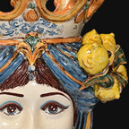 Handcrafted Teste di Moro ceramic with vibrant blue hair, lemon accents, and ornate crown details