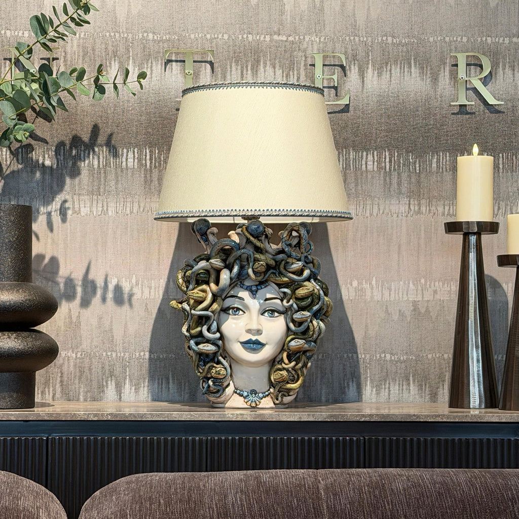 Handcrafted Medusa head table lamp with snake details, blending tradition and modern design for home decor.
