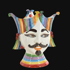 Hand-painted ceramic Testa di Moro with vibrant rainbow stripes, mustache, and jester crown, traditional Sicilian decor