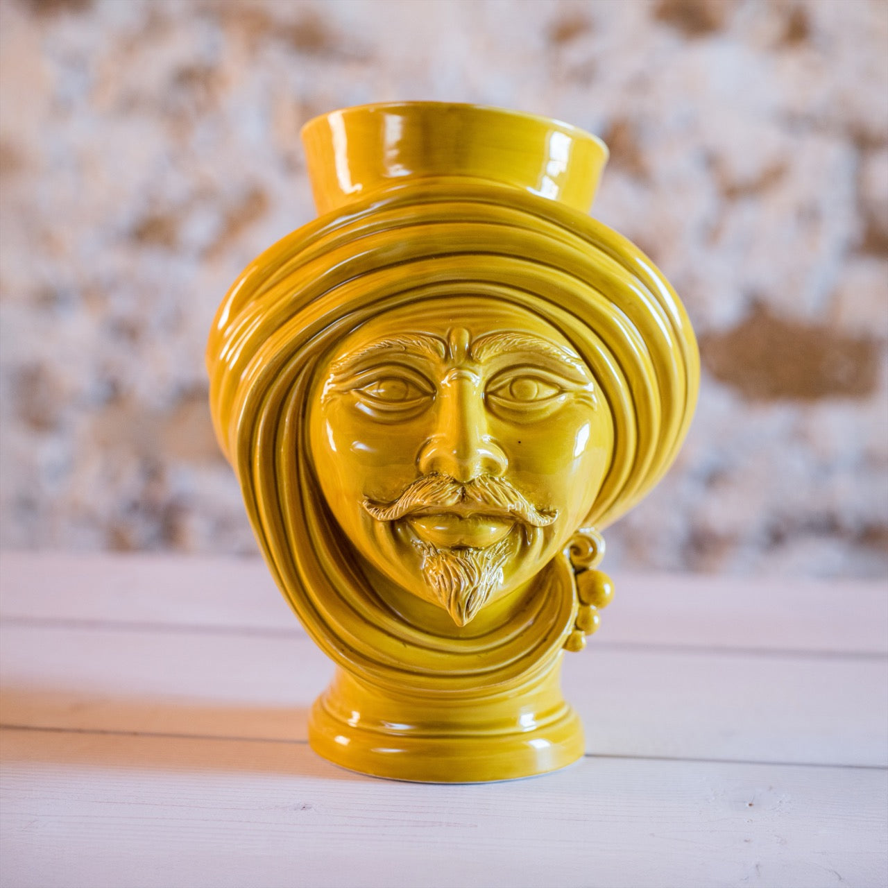 Yellow ceramic Testa di Moro vase with detailed facial features and turban design