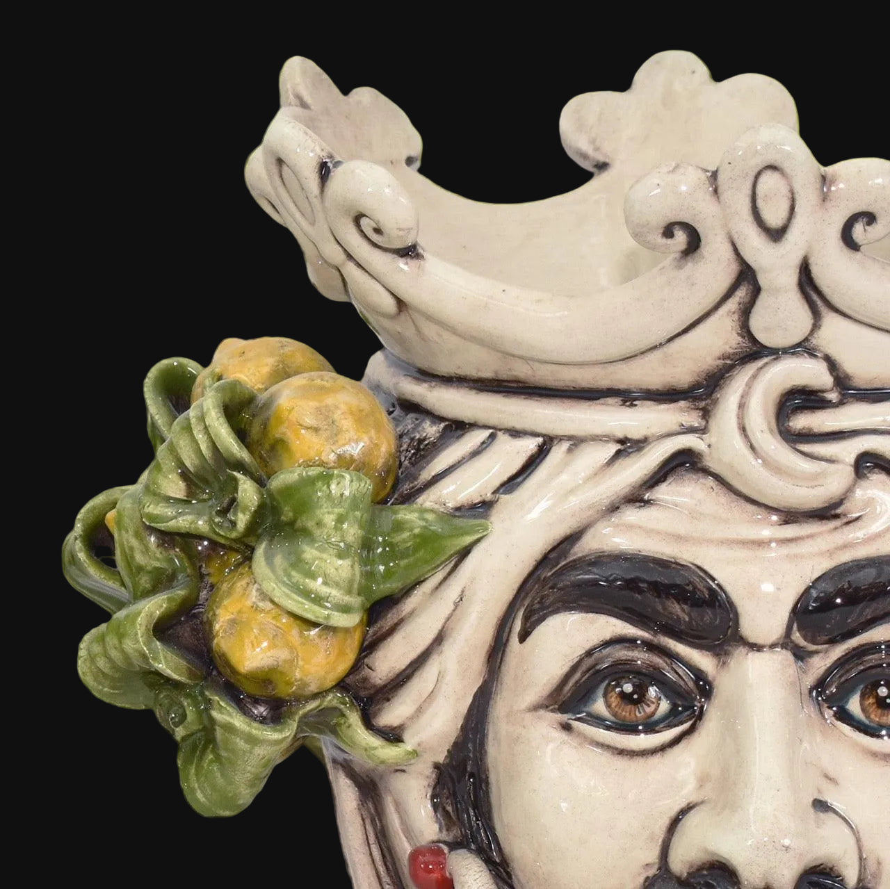 Handcrafted Teste di Moro ceramic with detailed crown, citrus fruit, and expressive eyes