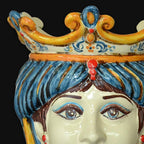Handcrafted Teste di Moro ceramic with vibrant blue hair, ornate crown, and expressive eyes