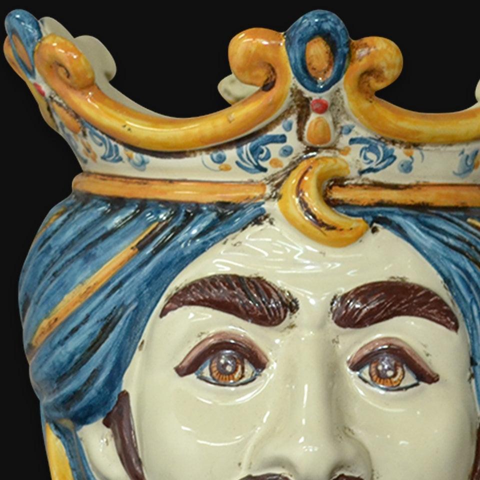 Handcrafted Teste di Moro ceramic face with blue turban and ornate crown, traditional Sicilian art