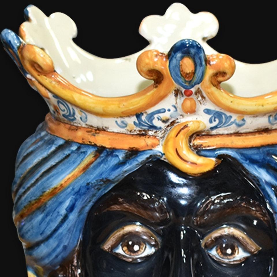 Handcrafted Teste di Moro ceramic with blue turban and ornate crown, traditional Sicilian art