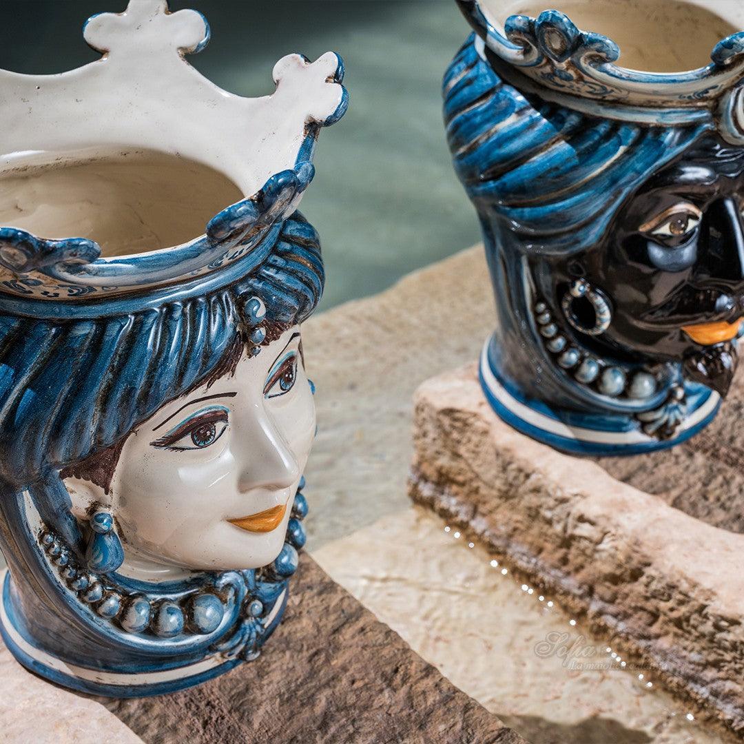 Handcrafted Teste di Moro ceramic vases with blue and white glaze, featuring detailed facial expressions and crowns.