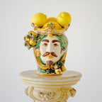 Handcrafted Teste di Moro ceramic vase with lemons, featuring vibrant colors and traditional Sicilian design.