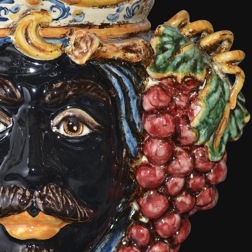 Handcrafted Teste di Moro ceramic with vibrant grapes and detailed facial features, blending tradition and modern design.