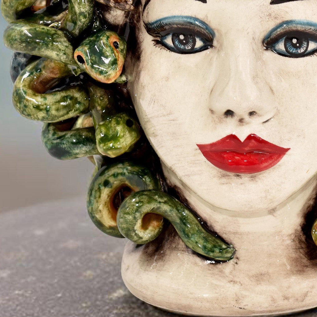 Handcrafted Teste di Moro ceramic with green snake hair, bold red lips, and striking blue eyes