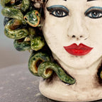 Handcrafted Teste di Moro ceramic with green snake hair, bold red lips, and striking blue eyes