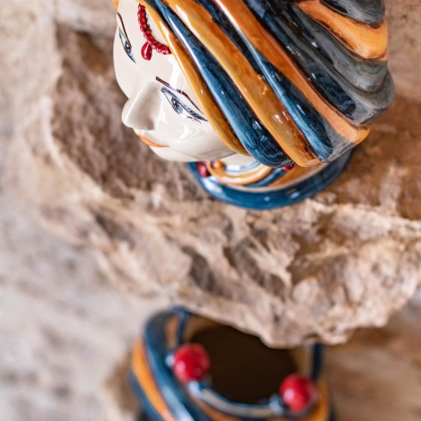 Hand-painted Teste di Moro ceramic vase with blue and orange swirls, traditional Sicilian design