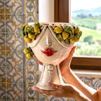 Handmade ceramic Teste di Moro planter with lemon garland, red lips, and traditional Sicilian tile background