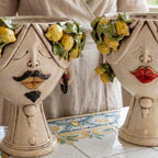 Handcrafted Teste di Moro ceramic vases with lemon-adorned faces, blending Sicilian tradition and modern design.