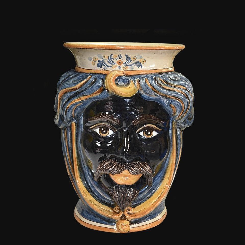 Handmade Sicilian Testa di Moro vase with blue hair, mustache, and decorative swirls, traditional ceramic art.