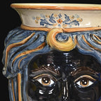 Handmade Teste di Moro ceramic vase with blue hair, floral details, and expressive eyes, blending tradition and modern design.