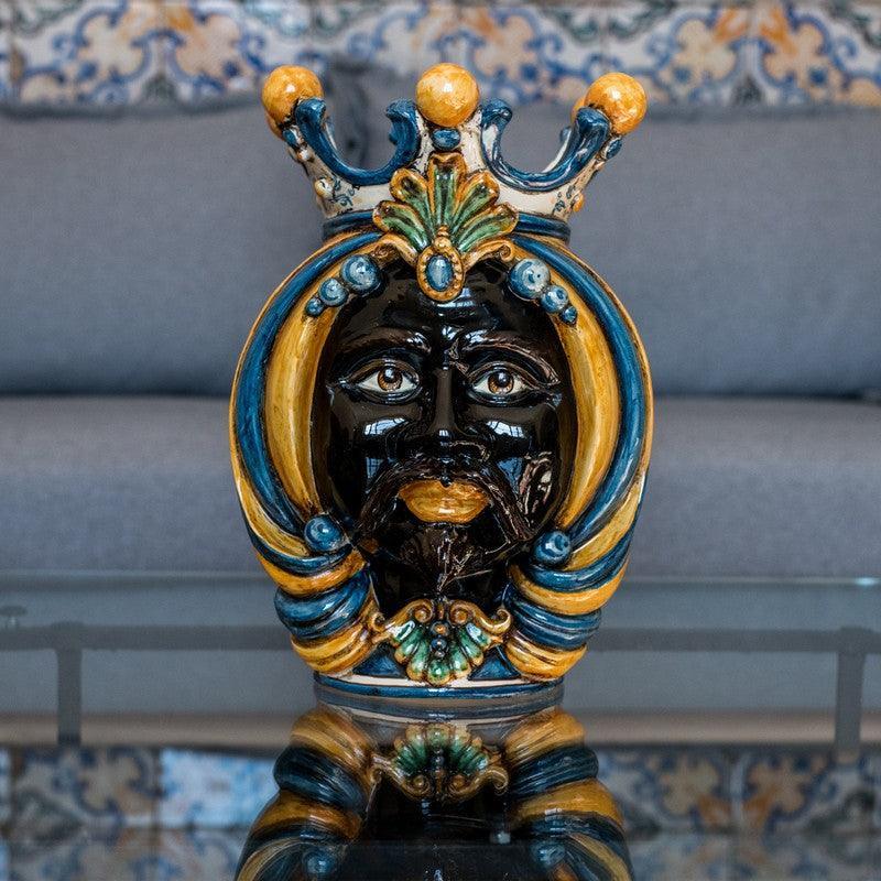 Handmade Teste di Moro ceramic sculpture with crown, vibrant blue and gold details, traditional Sicilian art