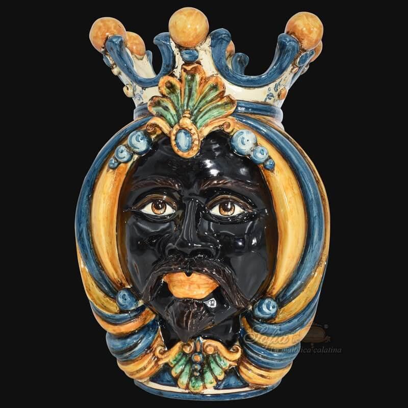 Handcrafted Teste di Moro ceramic face with crown, vibrant blue and gold details, traditional Sicilian art
