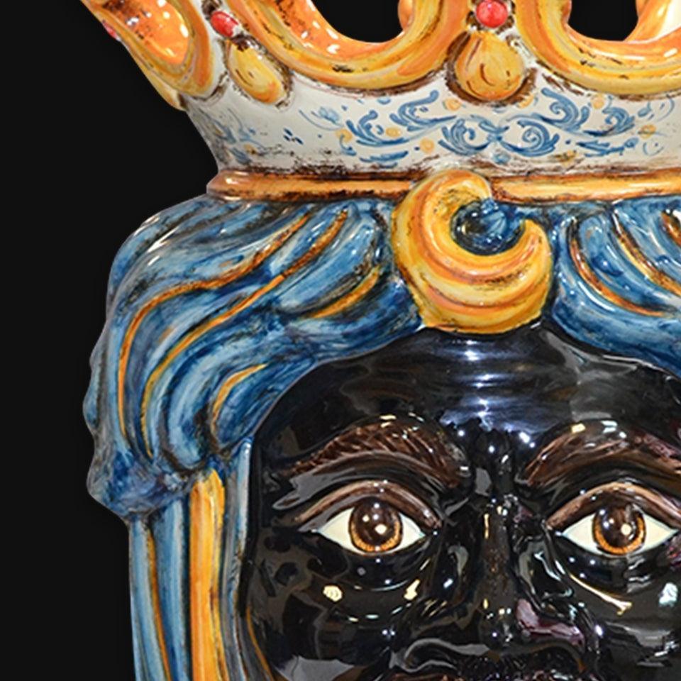 Handcrafted Teste di Moro ceramic with vibrant blue hair and ornate crown, blending tradition and modern design.