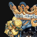 Handcrafted Teste di Moro ceramic with ornate crown and lemon motif, blending tradition and modern design.