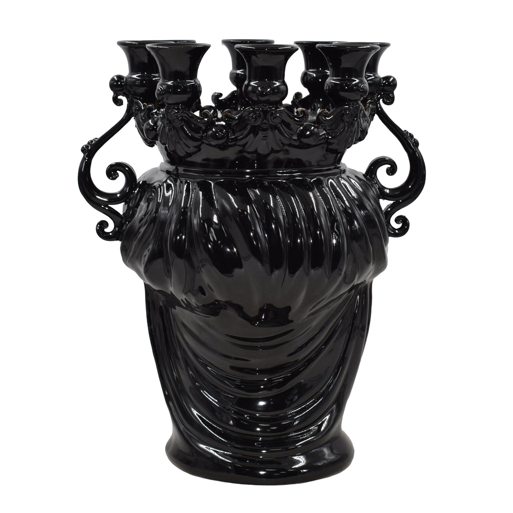 Glossy black Teste di Moro vase with ornate handles and multiple spouts, blending tradition and modern design.