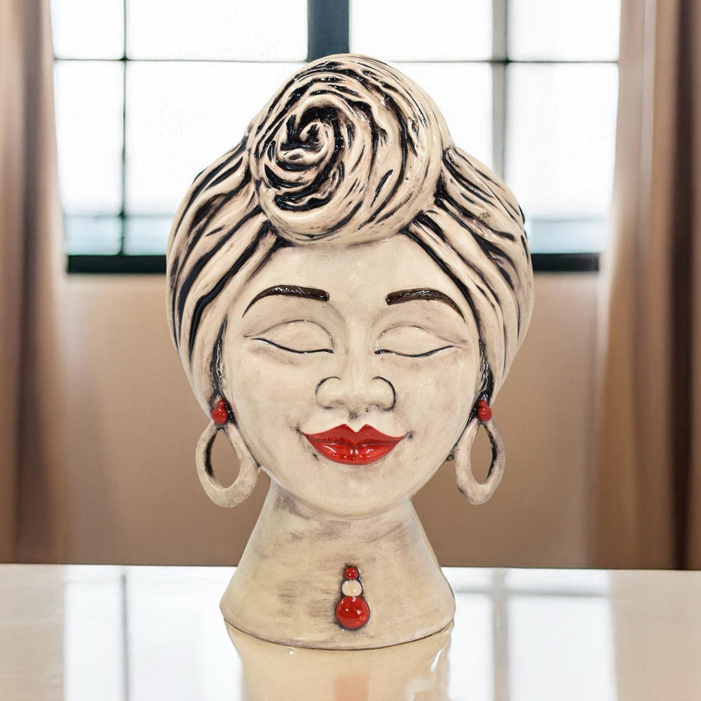 Handmade Teste di Moro ceramic bust with red lips, earrings, and rose turban, blending tradition and modern design.
