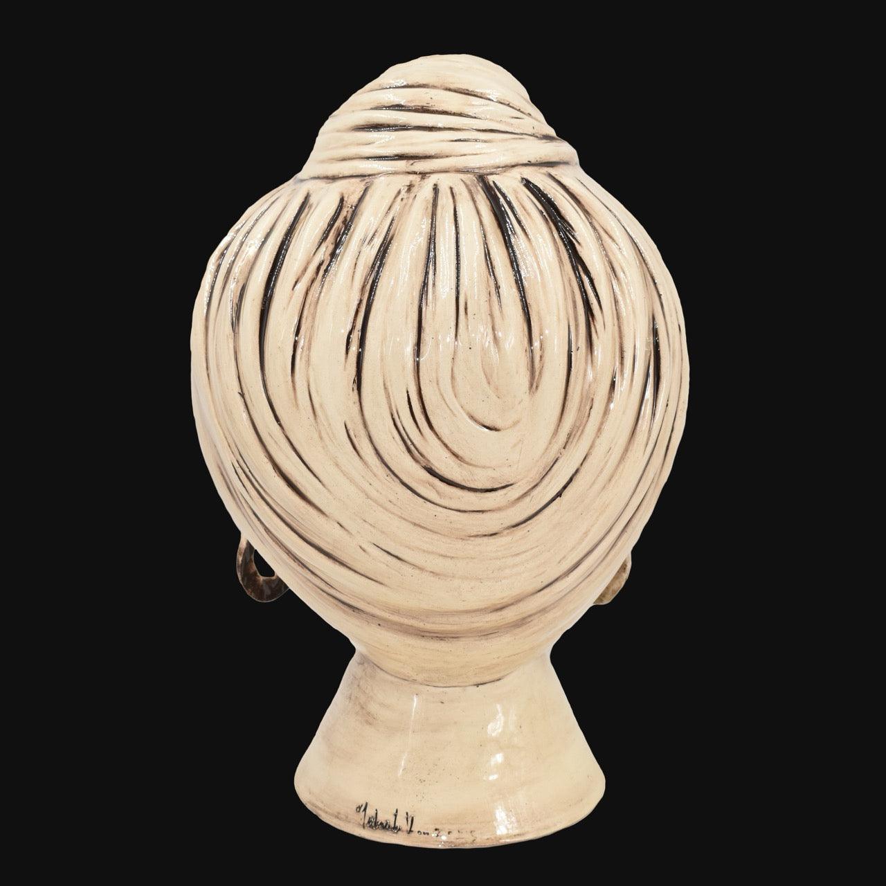 Handcrafted Teste di Moro ceramic head with swirling black and cream glaze, traditional Sicilian design